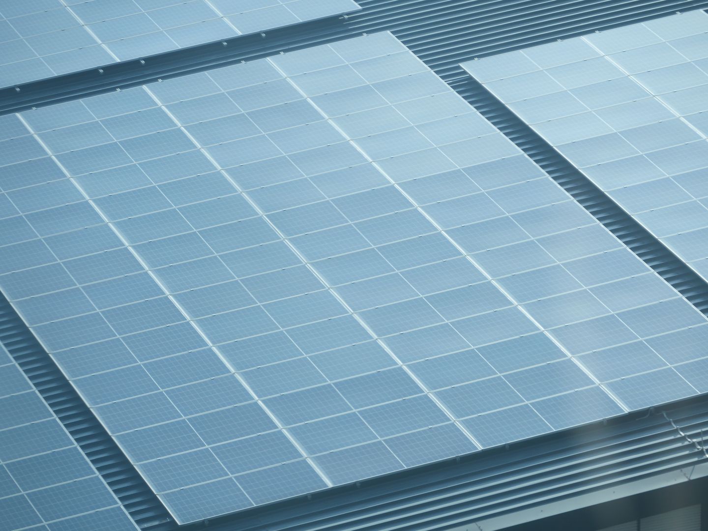 Detailed view of solar panels installed on a rooftop, showcasing green energy.